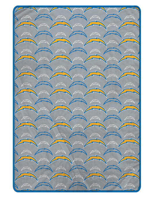 Chargers blanket with repeated logo design on a gray background