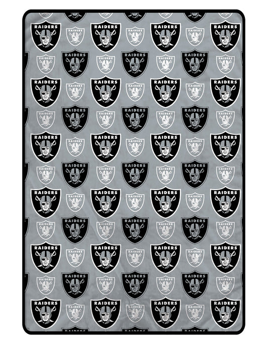 Raiders blanket with repeated logo pattern on a black background